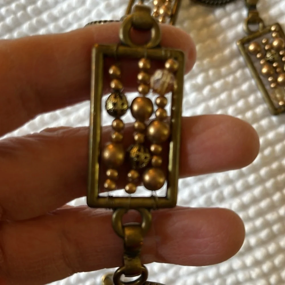 Women’s chain with metal circular and rectangular patterns belt.